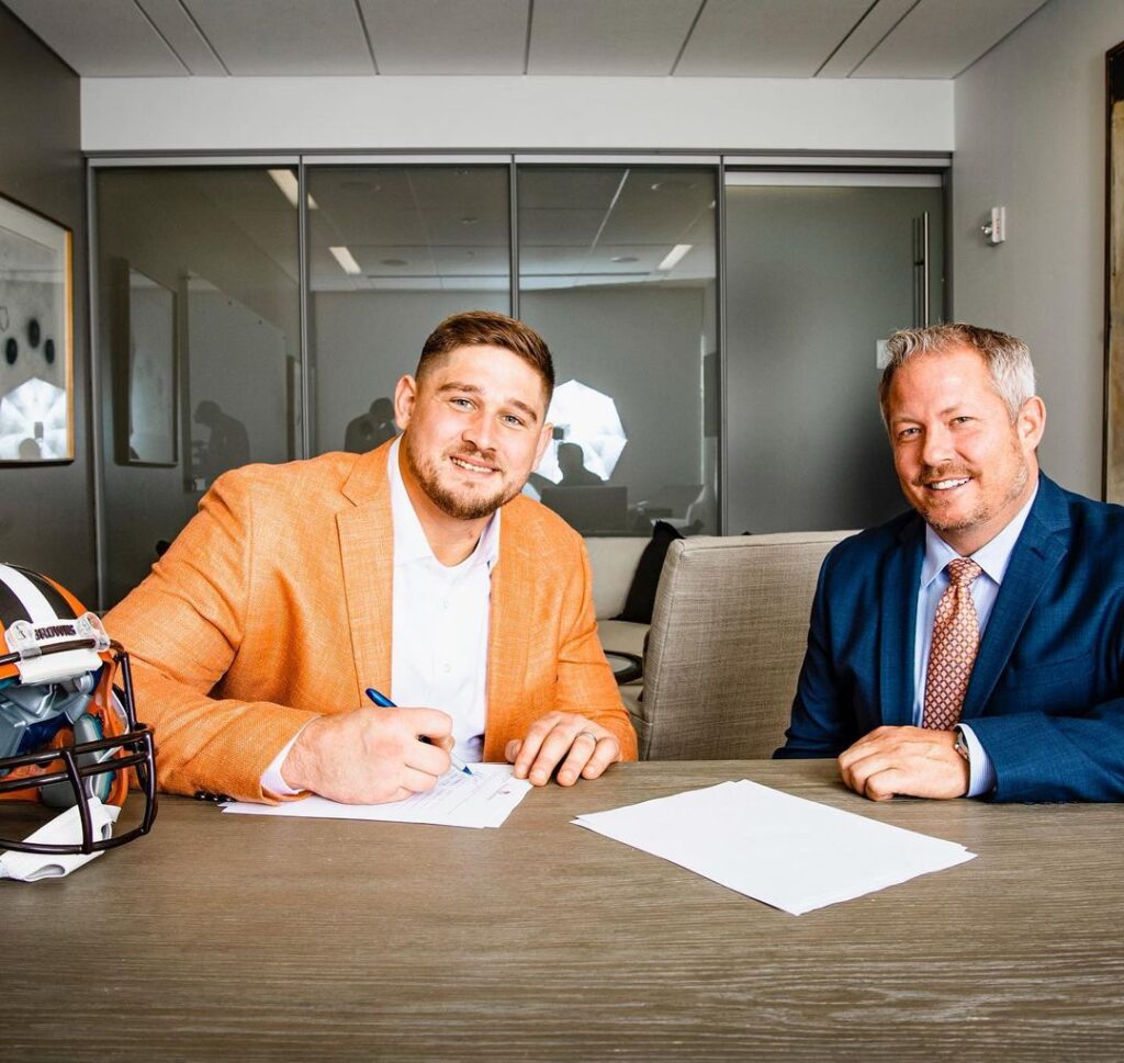 NFL Agent Andy Ross with client Wyatt Teller signing record-breaking contract with Cleveland Browns