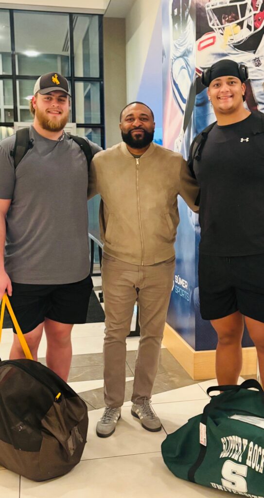 Emanuel Drakes with Caden Barnett and Joe Cooper