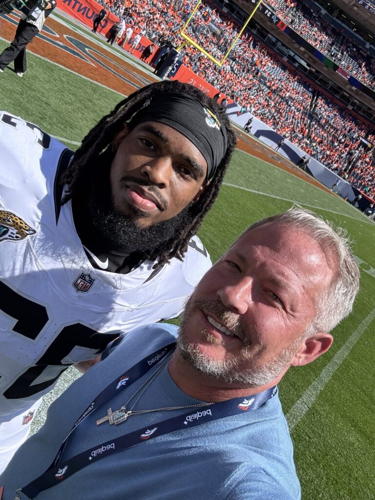 NFL agent Andy Ross with Jacksonville Jaguars running back Bhayshul Tuten on the field